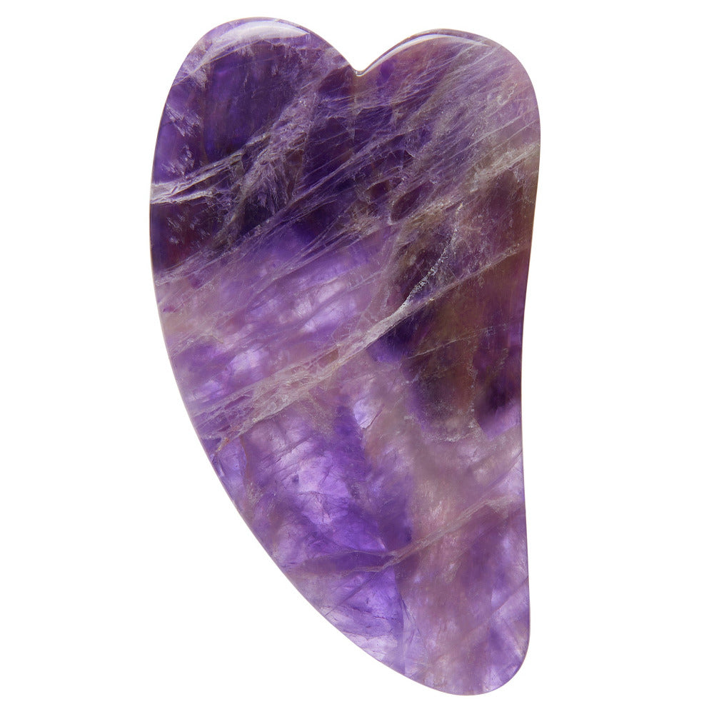 A polished purple amethyst gua sha massage tool with natural stone veining, shown on a solid white background.