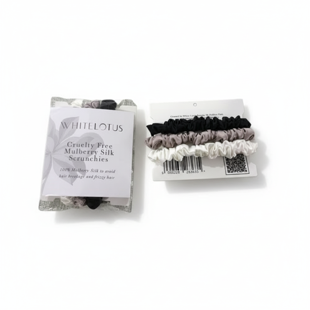 Packaged Whitelotus mulberry silk scrunchies on a white background