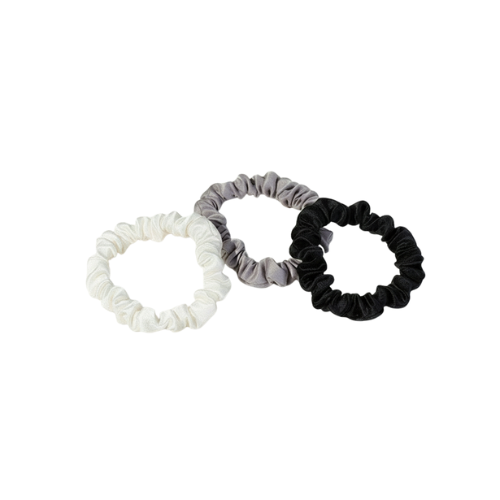 Three scrunchies in white, gray, and black on a white background